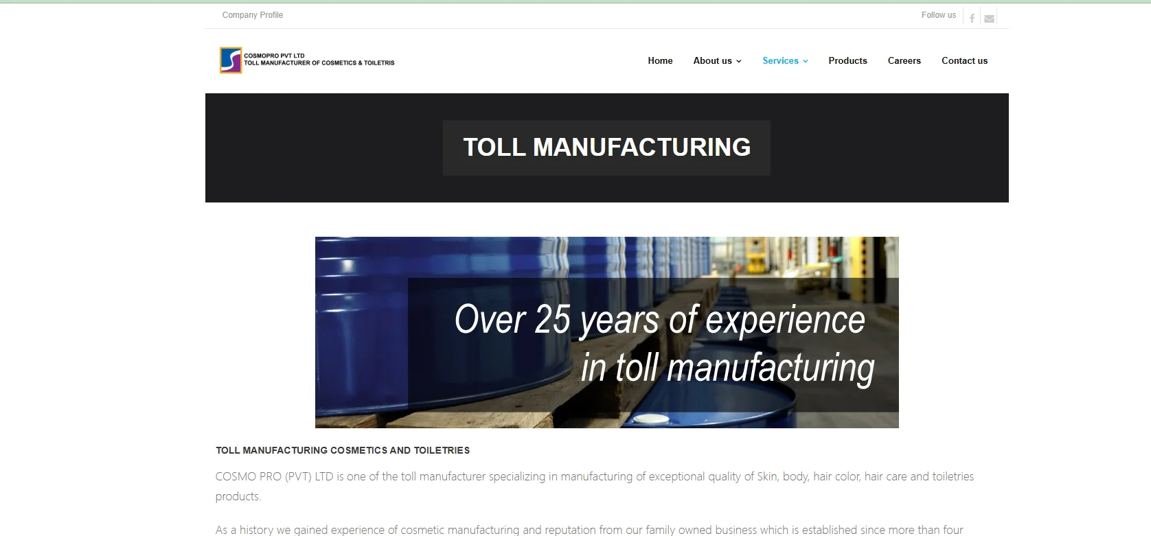 A webpage header for a toll manufacturing company displaying 'Over 25 years of experience in toll manufacturing' with blue industrial drums in the background.